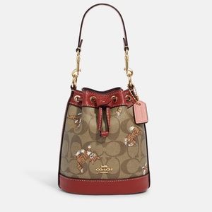 Mini Dempsey Bucket Bag In Signature Canvas With Dancing Kitten Print